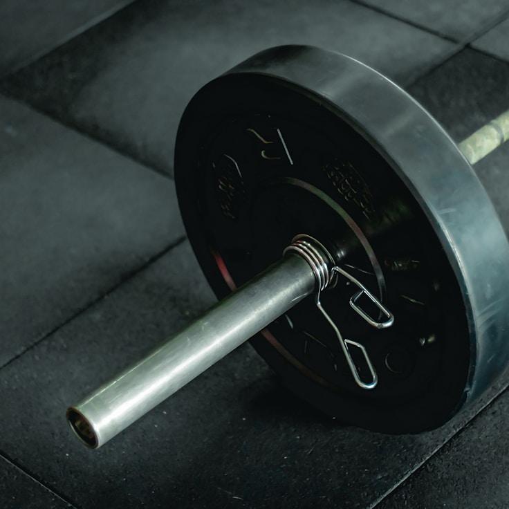 Women in a fitness class doing stretching and mobility exercises